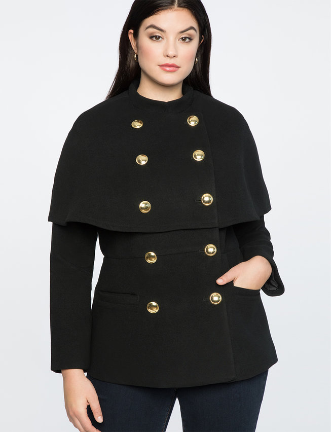 woman in cape jacket